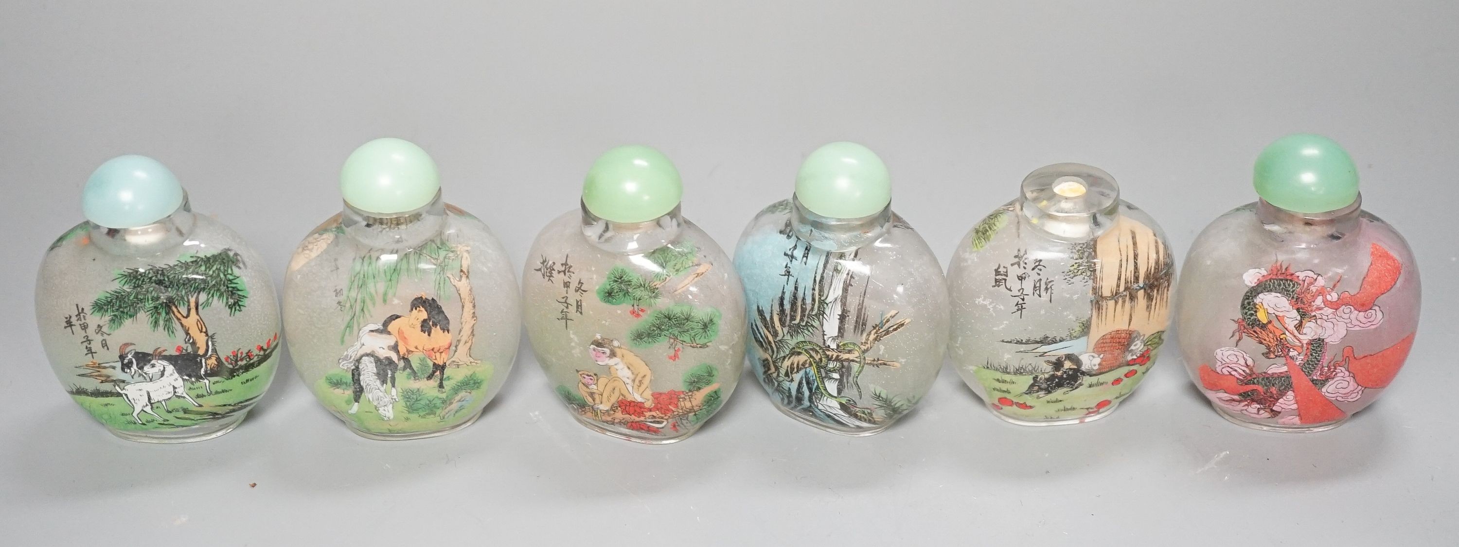 A boxed set of six Chinese inside-painted snuff bottles, height 8cm overall